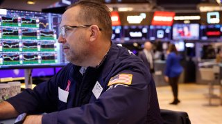 Traders work on the floor of the New York Stock Exchange during morning trading on February 14, 2024 in New York City. 