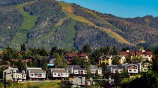 Houses dot the landscape at Colorado's Steamboat Ski Resort on Aug. 3, 2022, in Steamboat Springs, Colo.