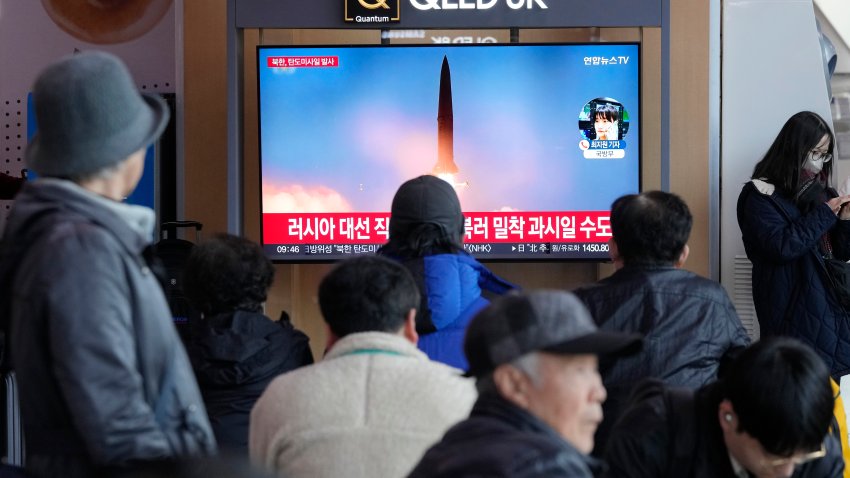 A TV screen shows a file image of North Korea's missile launch during a news program at the Seoul Railway Station in Seoul, South Korea.