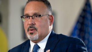 FILE – Education Secretary Miguel Cardona speaks during an interview, Sept. 20, 2023, in Washington.