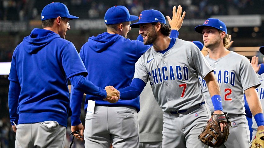 Mar 31, 2024; Arlington, Texas, USA; Chicago Cubs shortstop Dansby Swanson (7) shakes the hand of manager Craig Counsell after the Cubs defeat the Texas Rangers at Globe Life Field. Mandatory Credit: Jerome Miron-USA TODAY Sports