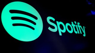 The Spotify logo is displayed on a screen on the floor of the New York Stock Exchange in New York City, Dec. 4, 2023.