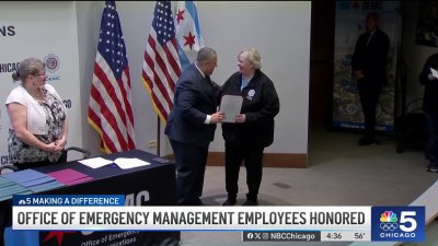 Workers with Chicago's Office of Emergency Management & Communications honored