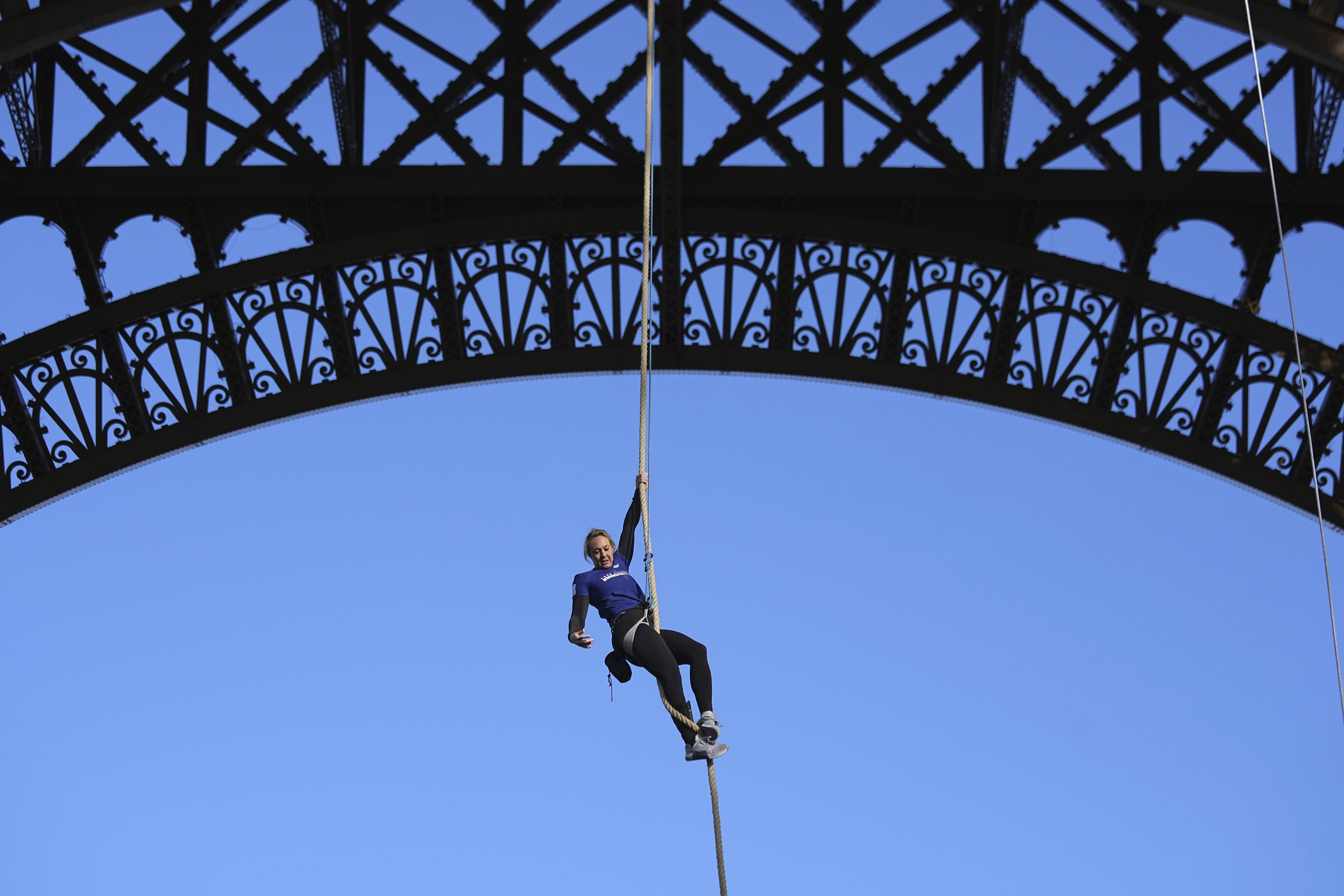 French woman climbs rope up Eiffel Tower for new world record – NBC Chicago
