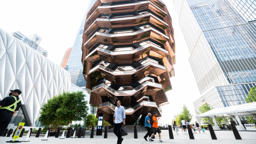 NEW YORK, NEW YORK – MAY 26: People walk by The Vessel at the Hudson Yards on May 26, 2021 in New York City.