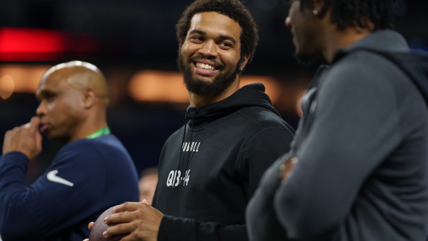 INDIANAPOLIS, INDIANA – MARCH 2: Caleb Williams #QB14 of USC watches drills from the sidelines at Lucas Oil Stadium on March 2, 2024 in Indianapolis, Indiana. (Photo by Todd Rosenberg/Getty Images)