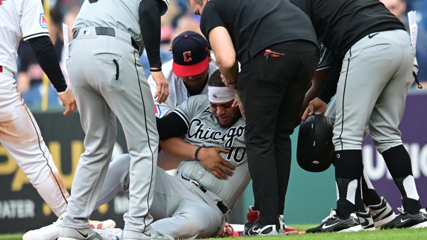 Apr 9, 2024; Cleveland, Ohio, USA; Chicago White Sox third baseman Yoan Moncada (10) is helped up after being injured during the second inning against the Cleveland Guardians at Progressive Field. Mandatory Credit: Ken Blaze-USA TODAY Sports