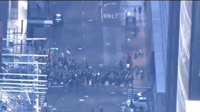At least 50 people arrested after protests in the Loop, near O'Hare