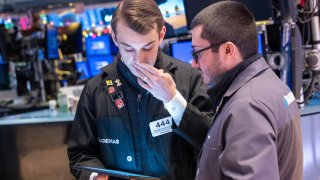 Traders work on the floor of the New York Stock Exchange (NYSE) on the first trading day of 2024 on Jan. 2, 2024 in New York City.