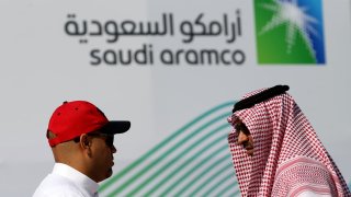 Members of media chat before the start of a press conference by Aramco at the Plaza Conference Center in Dhahran, Saudi Arabia November 3, 2019.