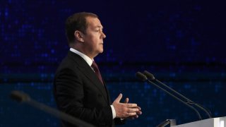 In this pool photograph distributed by Sputnik agency, Chairman of the United Russia party Dmitry Medvedev addresses the audience during the United Russia party congress in Moscow, on December 17, 2023.