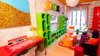 The living space of the Skittles-themed micro-apartment.