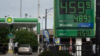 A sign displays gas prices at a gas station on May 21, 2024 in Chicago, Illinois.