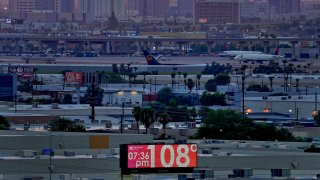 FILE – The unofficial temperature hits 108 degrees at dusk at Sky Harbor International Airport in Phoenix on July 12, 2023.