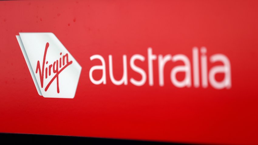 File. Signage for Virgin Australia Holdings Pty Ltd. at Sydney Airport in Sydney, Australia.