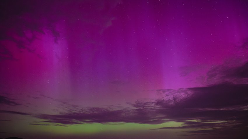 Northern lights (Aurora Borealis), also known as aurora, colorful lights shift, illuminate the sky in Debrad, Slovakia, May 11, 2024. (Photo by Robert Nemeti/Anadolu via Getty Images)