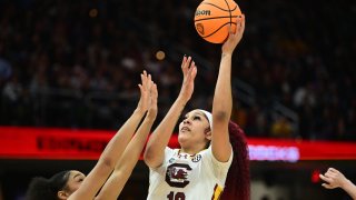 Apr 7, 2024; Cleveland, OH, USA; South Carolina Gamecocks center Kamilla Cardoso (10) shoots against Iowa Hawkeyes orward Hannah Stuelke (45) in the first quarter at Rocket Mortgage FieldHouse. Mandatory Credit: Ken Blaze-USA TODAY Sports