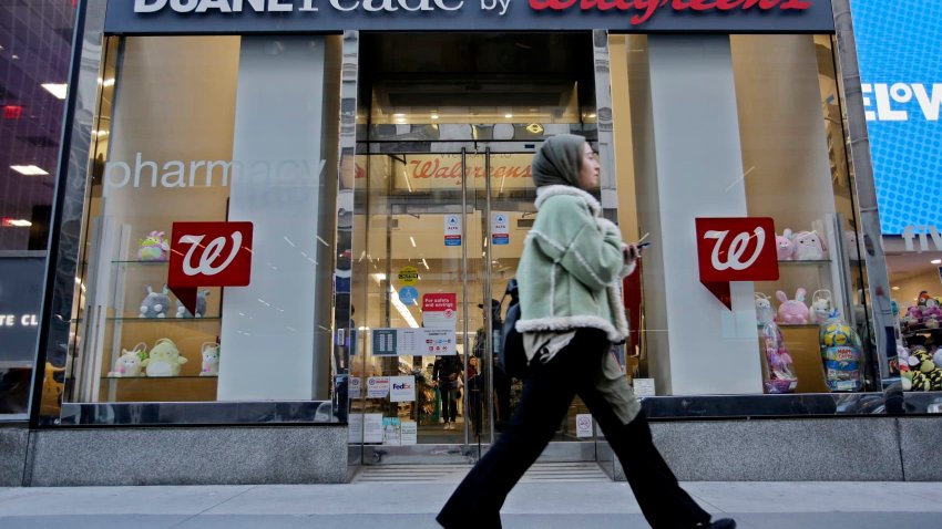 A woman walks near a Walgreens pharmacy on March 09, 2023 in New York City. 