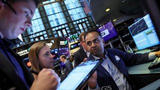 Traders work on the floor of the New York Stock Exchange in New York City, U.S., July 12, 2023.