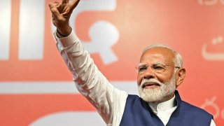 India’s Prime Minister Narendra Modi flashes victory sign at the Bharatiya Janata Party (BJP) headquarters to celebrate the party’s win in country’s general election, in New Delhi on June 4, 2024. 