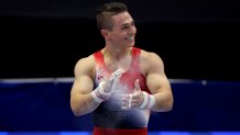 Paul Juda reacts after finishing his routine on the high bar on Day 1 of the 2024 U.S. Olympic Team Gymnastics Trials.