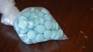 Illicit drugs like these fentanyl-laced pills seized by the Drug Enforcement Administration have been found to contain a potent animal sedative called medetomidine.