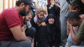 A Palestinian family mourns a loved one killed by Israeli bombardment, as they take a last look before their funeral in Khan Younis, southern Gaza Strip, on June 21, 2024.