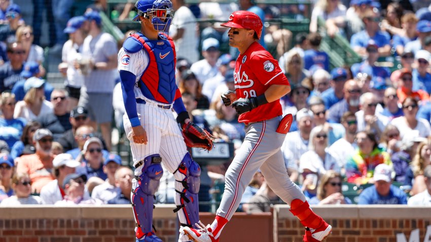 Jun 2, 2024; Chicago, Illinois, USA;
Cincinnati Reds outfielder TJ Friedl (29) crosses home plate after hitting a three-run home run against the Chicago Cubs during the second inning at Wrigley Field. Mandatory Credit: Kamil Krzaczynski-USA TODAY Sports