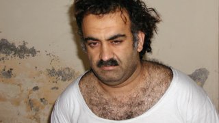 In a file photo Khalid Sheikh Mohammed, the alleged Sept. 11 mastermind, is seen shortly after his capture during a raid in Pakistan Saturday March 1, 2003, in this photo obtained by the Associated Press.