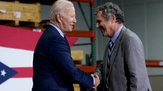 U.S. President Joe Biden shakes hands with Senator Sherrod Brown (D-OH) before delivering remarks during a visit at United Performance Metals in Hamilton, Ohio, May 6, 2022.