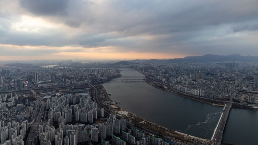 Commercial and residential buildings seen from the rooftop of the Lotte Corp. World Tower at sunset in Seoul, South Korea, on Tuesday, Nov. 28, 2023. 