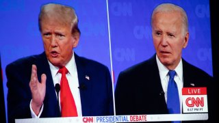 The first presidential debate between U.S. President Joe Biden and former U.S. President and Republican presidential candidate Donald Trump is projected on a screen projector during a watch party hosted by the Michigan Conservative Coalition in Novi, Michigan, U.S., June 27, 2024. 