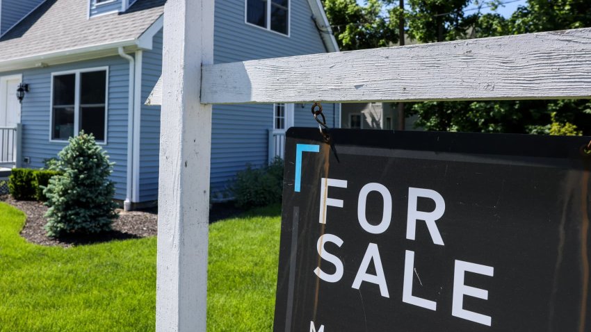 Patchogue, N.Y.: A For Sale sign hangs in front of a house in Patchogue, New York, on June 1, 2024.