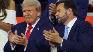 Republican presidential nominee and former U.S. President Donald Trump and Republican vice presidential nominee J.D. Vance applaud during Day 1 of the Republican National Convention (RNC), at the Fiserv Forum in Milwaukee, Wisconsin, U.S., July 15, 2024.