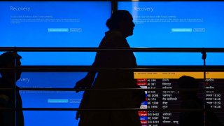 Passengers seen waiting after a major disruption in Microsoft Corp.’s cloud services caused widespread flight cancellations and delays at T3 IGI Airport in New Delhi, India, on July 19, 2024.