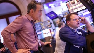 Traders work on the floor of the New York Stock Exchange during afternoon trading on July 26, 2024 in New York City.