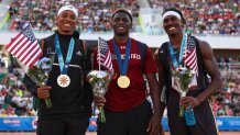 Silver medalist Russell Robinson, gold medalist Salif Mane and bronze medalist Donald Scott pose