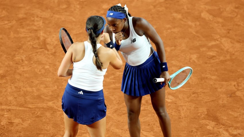 Coco Gauff and Jessica Pegula on a tennis court.