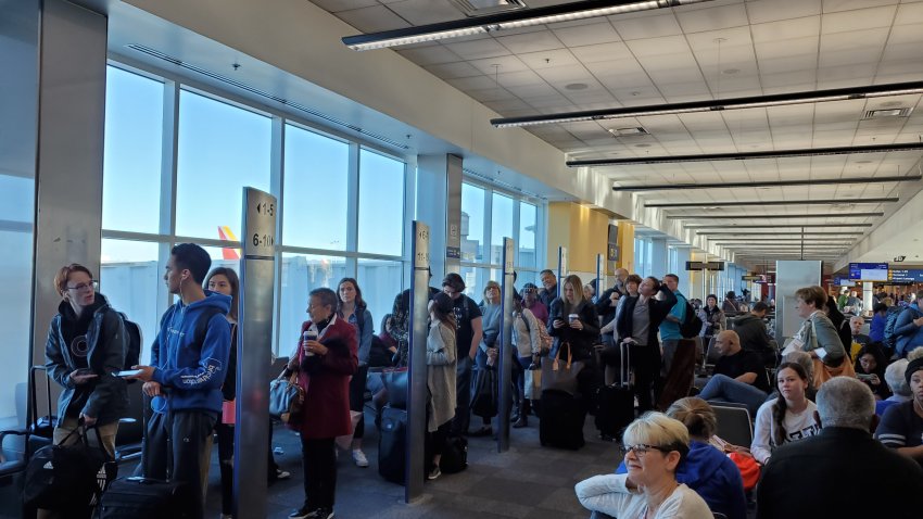 People line up based on boarding group numbers to board a Southwest Airlines flight at Oakland International Airport (OAK) in Oakland, California, January 5, 2020. (Photo by Smith Collection/Gado/Getty Images)