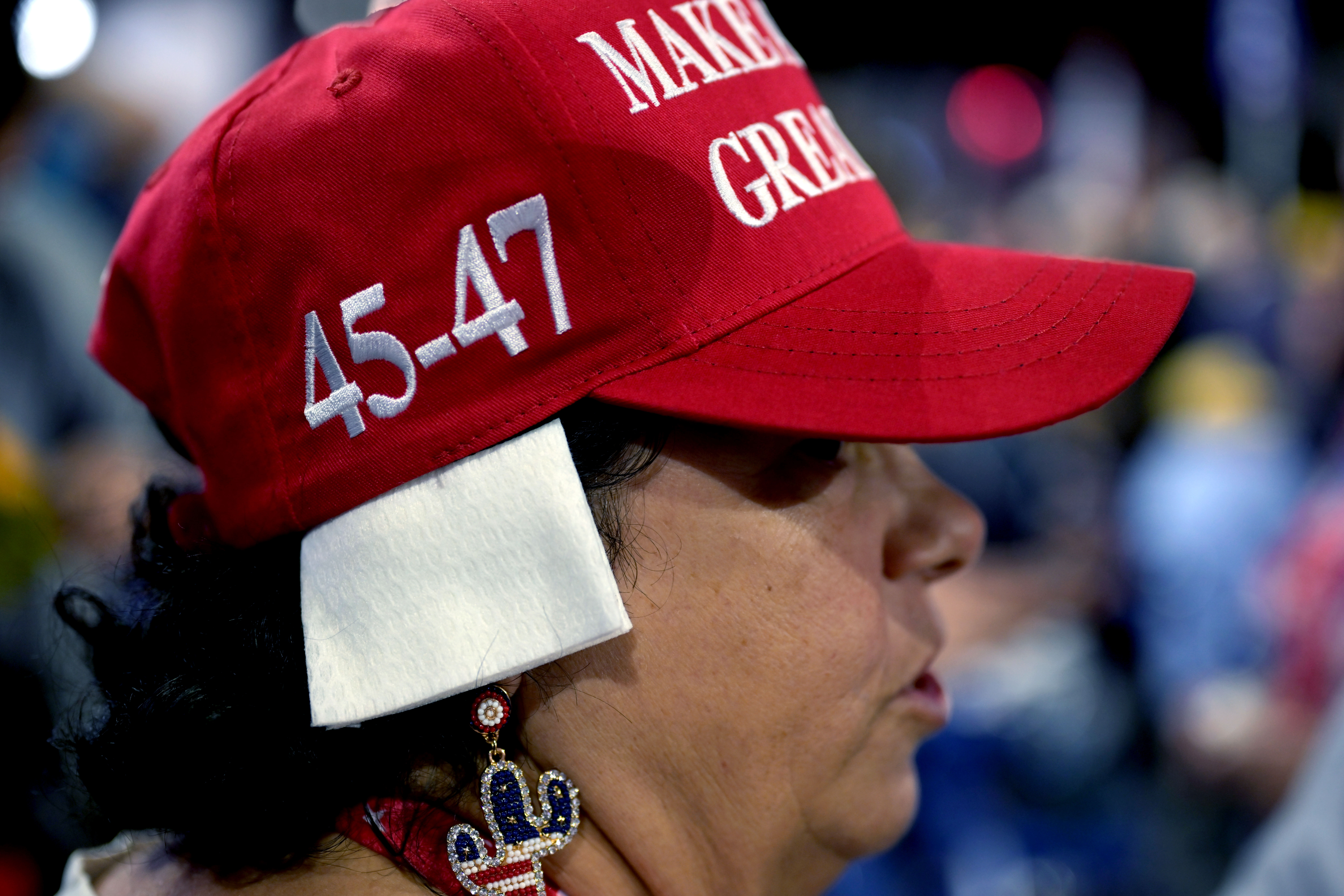 A delegate wears an imitation ear bandage during the Republican National Convention (RNC) at the Fiserv Forum in Milwaukee, Wisconsin, US, on Wednesday, July 17, 2024. The RNC chairman warned against complacency when his party concludes its official nominating jamboree this week with polls predicting ex-President Donald Trump prevailing over President Joe Biden in the November election. Photographer: Victor J. Blue/Bloomberg via Getty Images