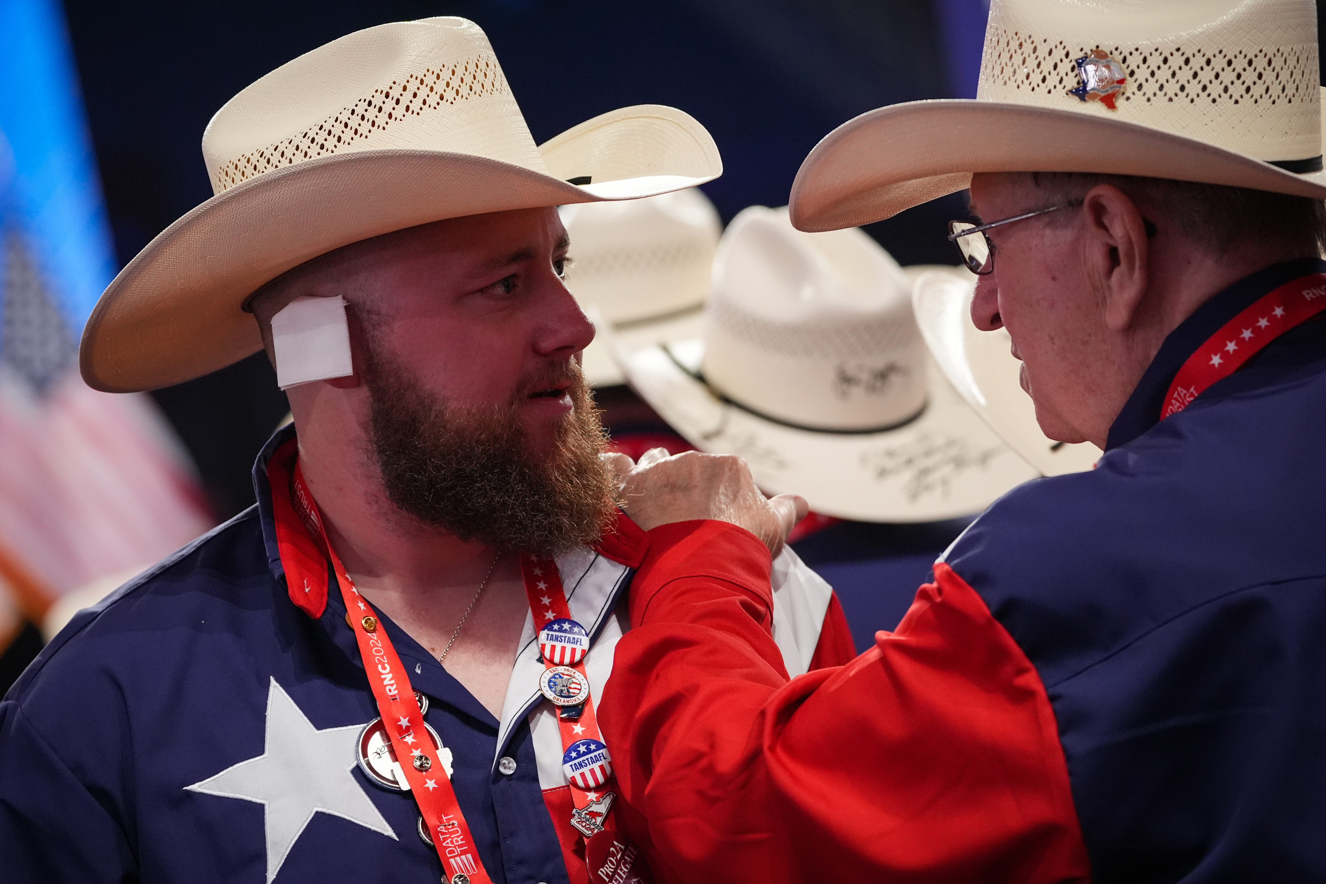 MILWAUKEE, WISCONSIN – JULY 17: A man wearing a cowboy hat has a “bandage” on his ear  on the third day of the Republican National Convention at the Fiserv Forum on July 17, 2024 in Milwaukee, Wisconsin. Delegates, politicians, and the Republican faithful are in Milwaukee for the annual convention, concluding with former President Donald Trump accepting his party’s presidential nomination. The RNC takes place from July 15-18.  (Photo by Andrew Harnik/Getty Images)