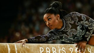 US’ Simone Biles competes in the balance beam event of the artistic gymnastics women’s qualification during the Paris 2024 Olympic Games at the Bercy Arena in Paris, on July 28, 2024. (Photo by Loic VENANCE / AFP) (Photo by LOIC VENANCE/AFP via Getty Images)