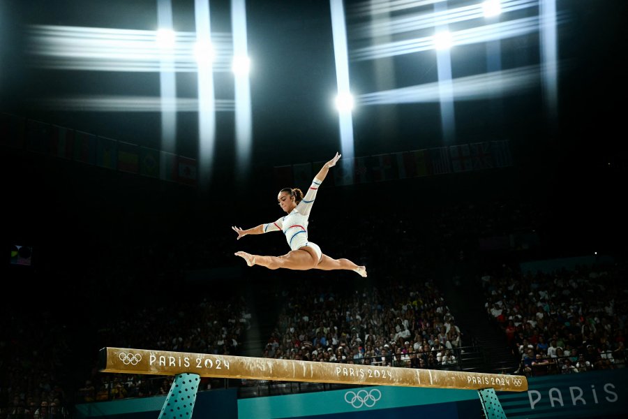 Coline Devillard competes in the balance beam