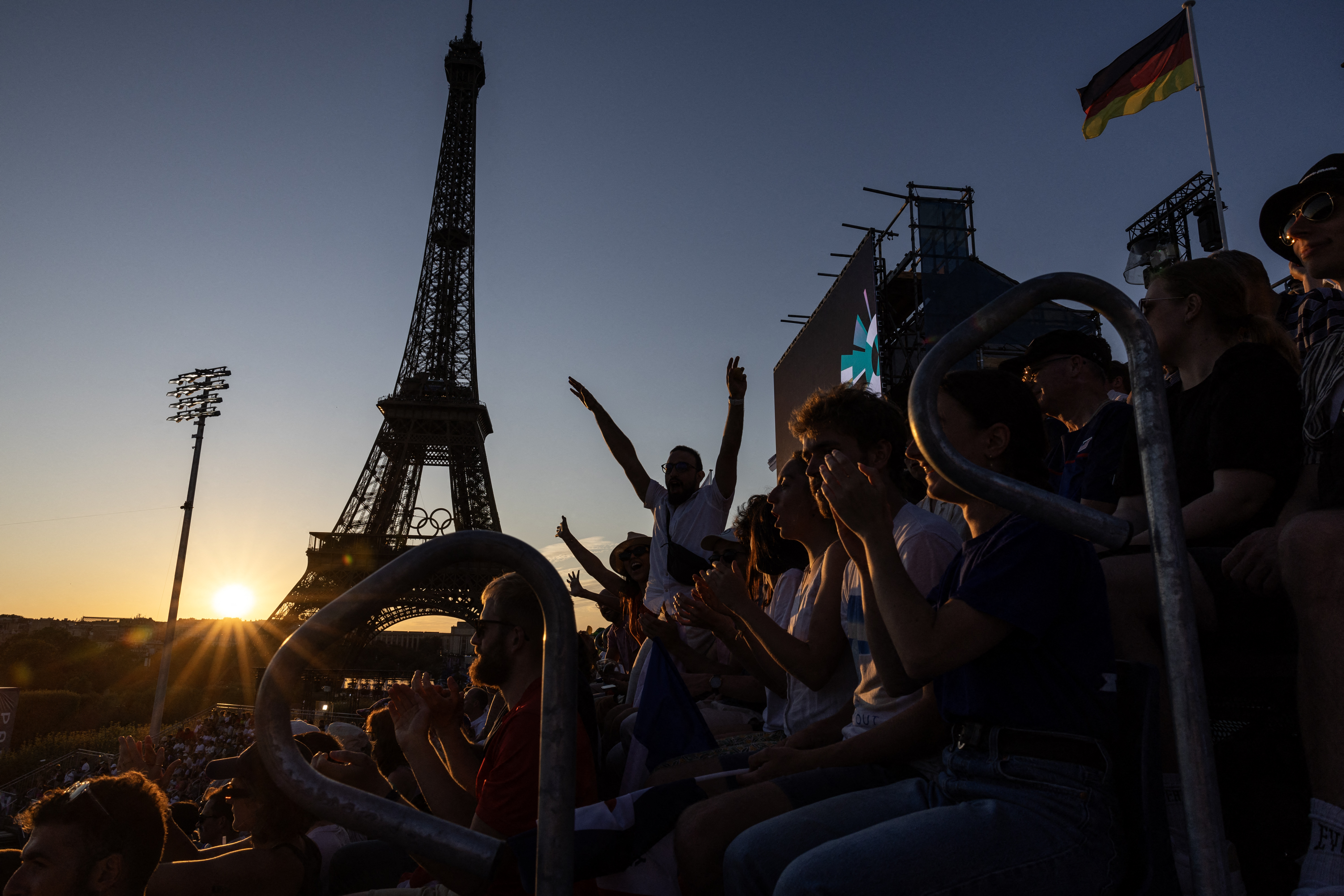 Beach volleyball at Eiffel Tower stadium draws crowds looking for the