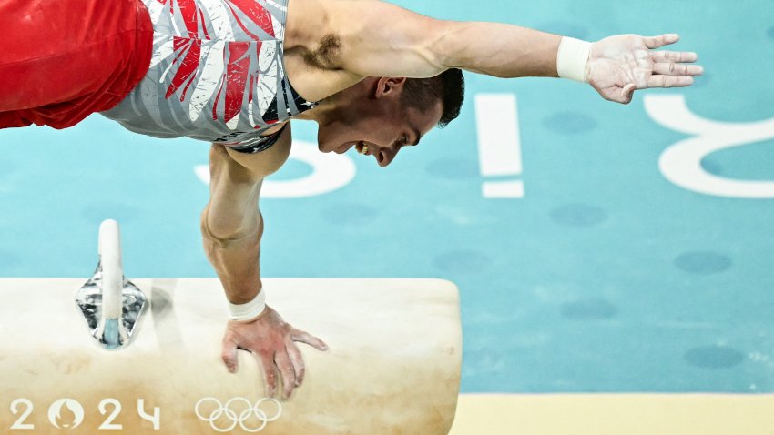 US’ Paul Juda competes in the pommel horse event of the artistic gymnastics men’s team final during the Paris 2024 Olympic Games at the Bercy Arena in Paris, on July 29, 2024. (Photo by Loic VENANCE / AFP) (Photo by LOIC VENANCE/AFP via Getty Images)