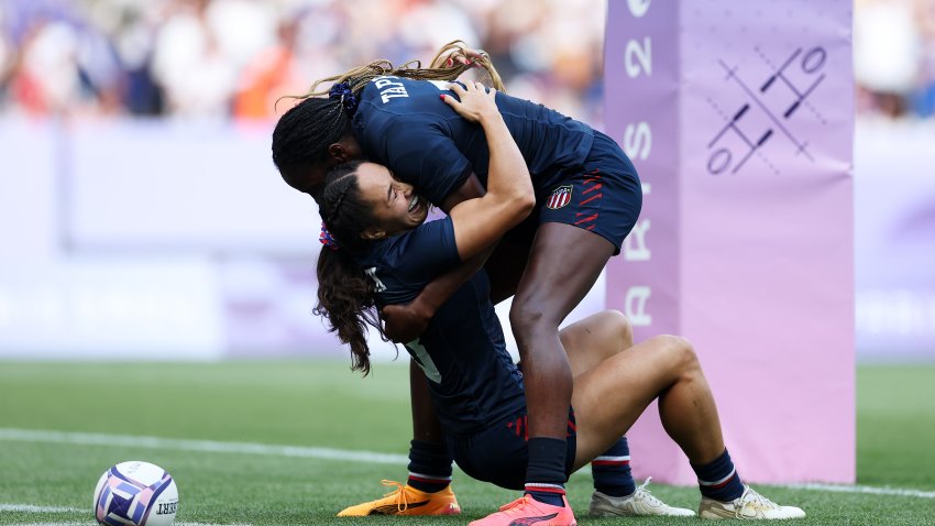 PARIS, FRANCE – JULY 30: Alex Sedrick #8 of Team United States celebrates with Naya Tapper #7 of Team United States after scoring her team’s second and winning try during the Women’s Rugby Sevens Bronze medal match between Team United States and Team Australia on day four of the Olympic Games Paris 2024 at Stade de France on July 30, 2024 in Paris, France. (Photo by Michael Steele/Getty Images)