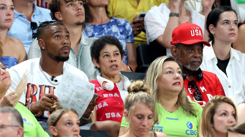 PARIS, FRANCE – JULY 30: Family members of Simone Biles of Team United States, (L-R) her husband Jonathan Owens and parents Nellie and Ronald Biles look on during the Artistic Gymnastics Women’s Team Final on day four of the Olympic Games Paris 2024 at Bercy Arena on July 30, 2024 in Paris, France. (Photo by Pascal Le Segretain/Getty Images)