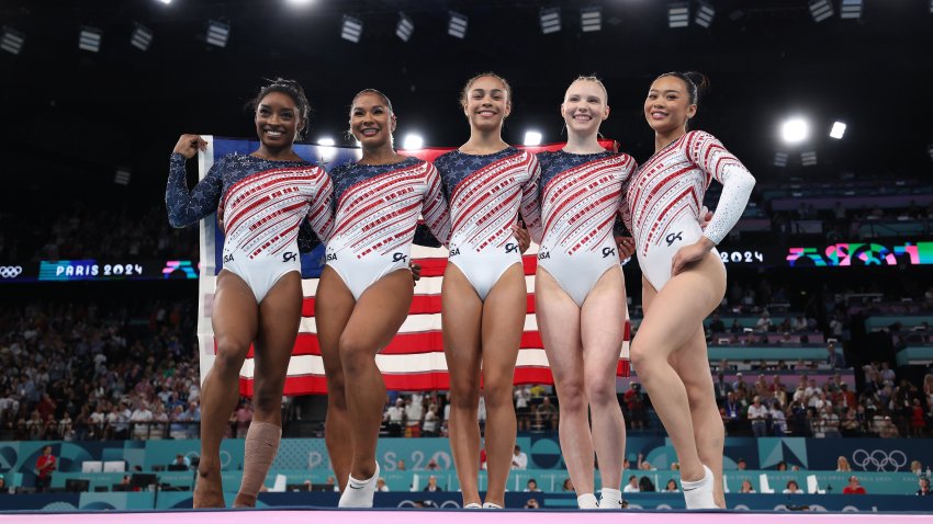 Simone Biles, Jordan Chiles, Hezly Rivera, Jade Carey and Sunisa Lee of Team United States celebrate after winning the gold medal during the Artistic Gymnastics Women's Team Final on day four of the Olympic Games Paris 2024 at Bercy Arena on July 30, 2024 in Paris, France.