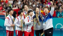 PARIS, FRANCE - JULY 30: Gold medalists China's Wang Chuqin and Sun Yingsha, silver medalists North Korea's Ri Jong Sik and Kim Kum Yong, bronze medalists South Korea's Lim Jonghoon and Shin Yubin pose for a selfie during the medal ceremony after the Table Tennis - Mixed Doubles Gold Medal match on day four of the Paris 2024 Olympic Games at South Paris Arena on July 30, 2024 in Paris, France. (Photo by Yao Yingkang/Zhejiang Daily/VCG via Getty Images)