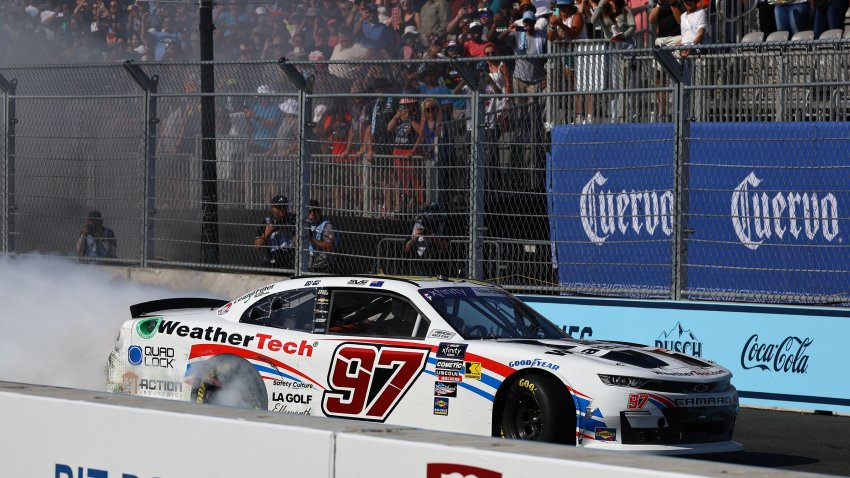 Jul 6, 2024; Chicago, Illinois, USA; Xfinity Series driver Shane Van Gisberaen (97) does a burnout after winning The Loop 121 at the Chicago Street Race. Mandatory Credit: Mike Dinovo-USA TODAY Sports